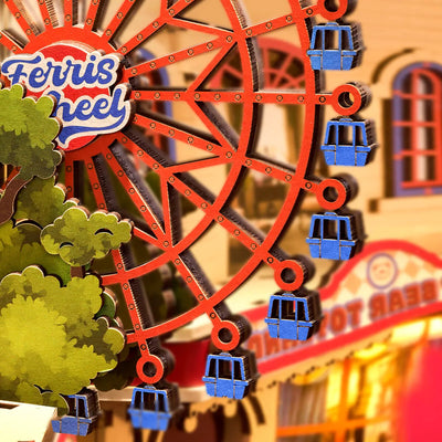 Detalle de la noria roja con cabinas azules de Fairytale Amusement Park.