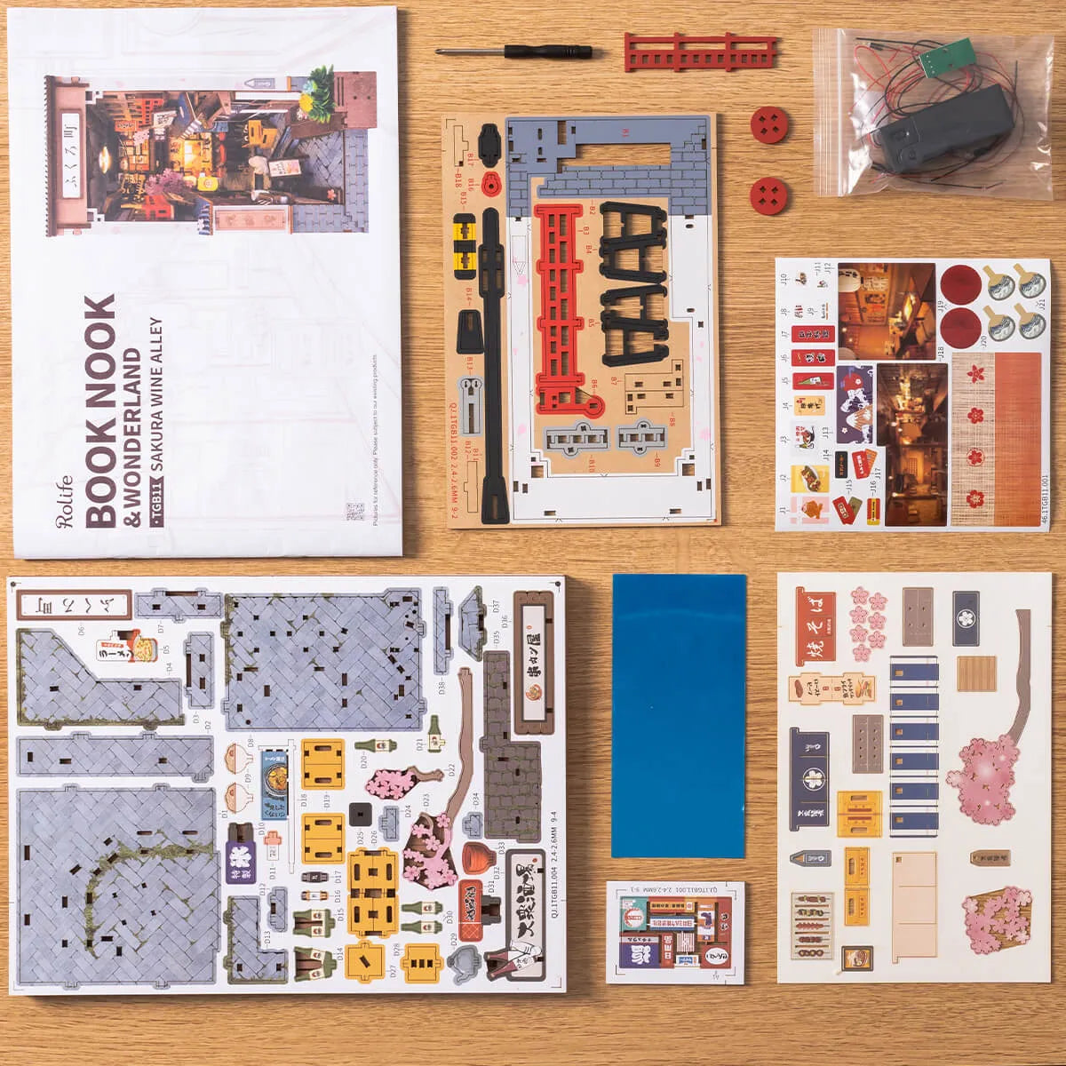 Instrucciones, paneles y componentes del kit Sakura Wine Alley extendidos.