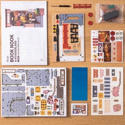 Instrucciones, paneles y componentes del kit Sakura Wine Alley extendidos.