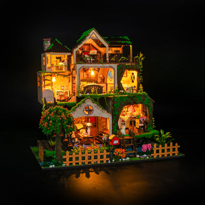Fairy Tale Forest de Hongda, iluminada sobre fondo oscuro