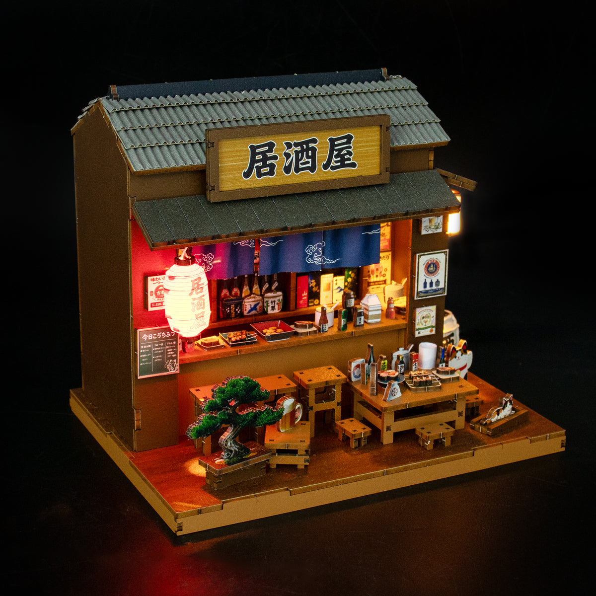 
Izakaya de Hongda, iluminada sobre fondo oscuro