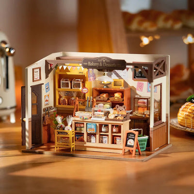 Panadería en miniatura iluminada sobre una mesa · Rolife