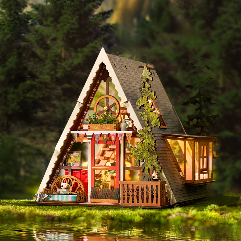 
Cabaña triangular en una escena de bosque junto al agua · Rolife